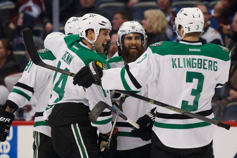 Dallas Stars right wing Patrick Eaves, second from right, celebrates his empty-net goal...