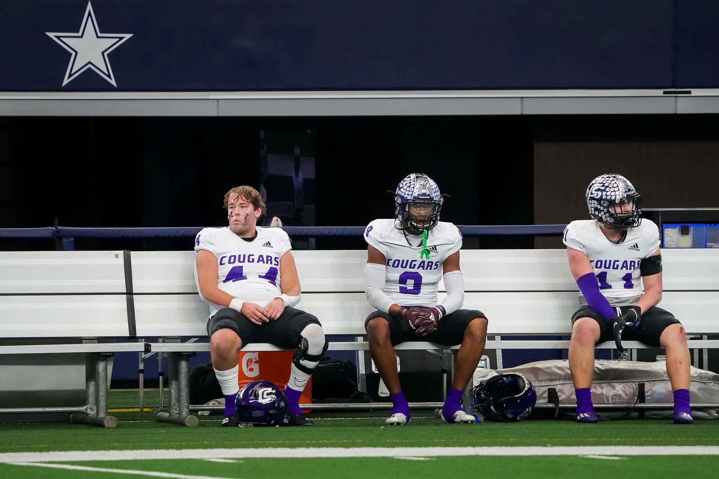 College Station players watch from the bench during the second half of a loss to Aledo in...