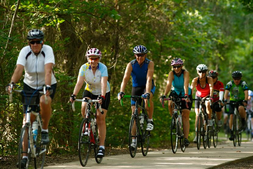 A bicycle club works out at Art Cowsen Memorial Trailhead in Fort Worth Friday,  July 10,...