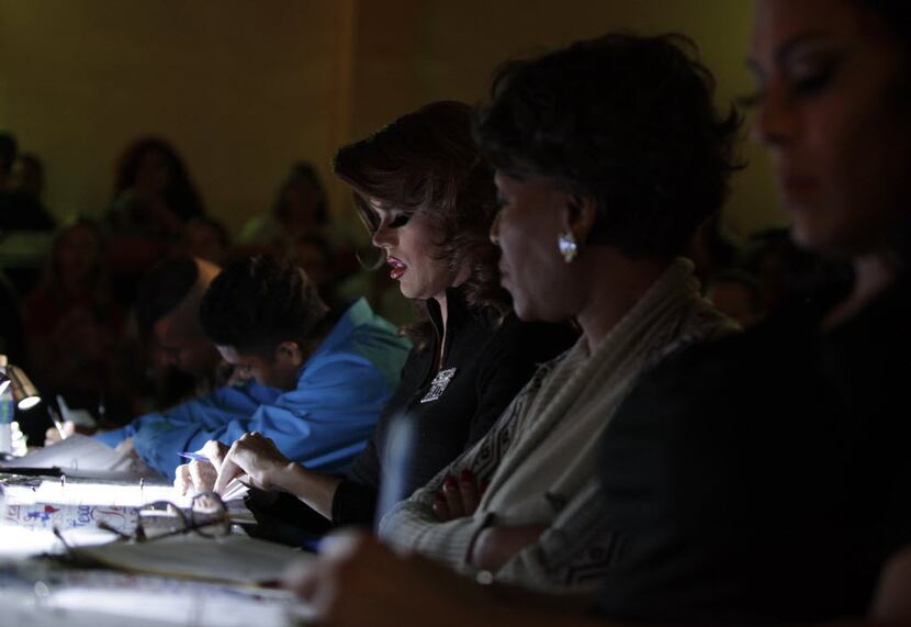 The judges take notes during the Miss Gay Texas America pageant at Station 4 in Dallas, TX,...