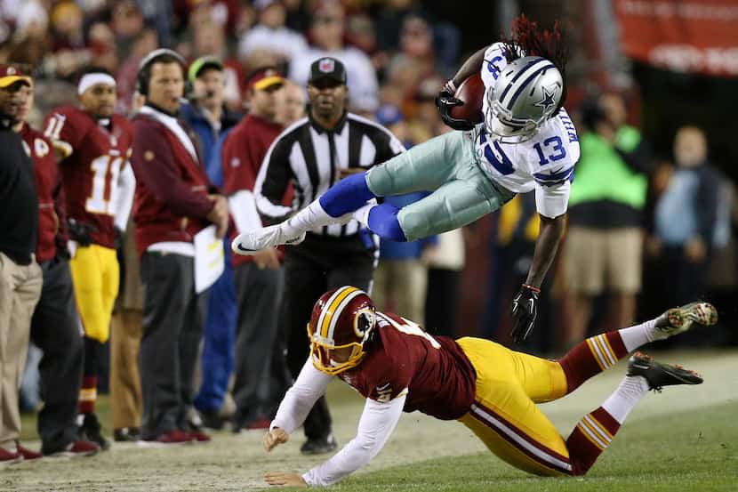 LANDOVER, MD - DECEMBER 7: Lucky Whitehead #13 of the Dallas Cowboys is knocked out of...