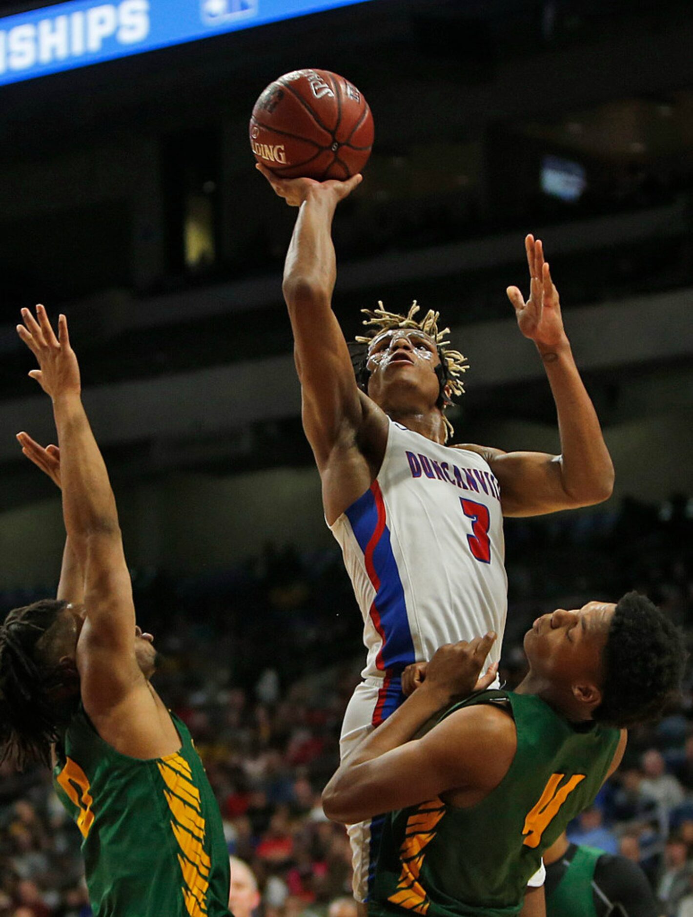 Duncanville's Jahmi'us Ramsey #3 scores. UIL boys basketball 6A State Final between...