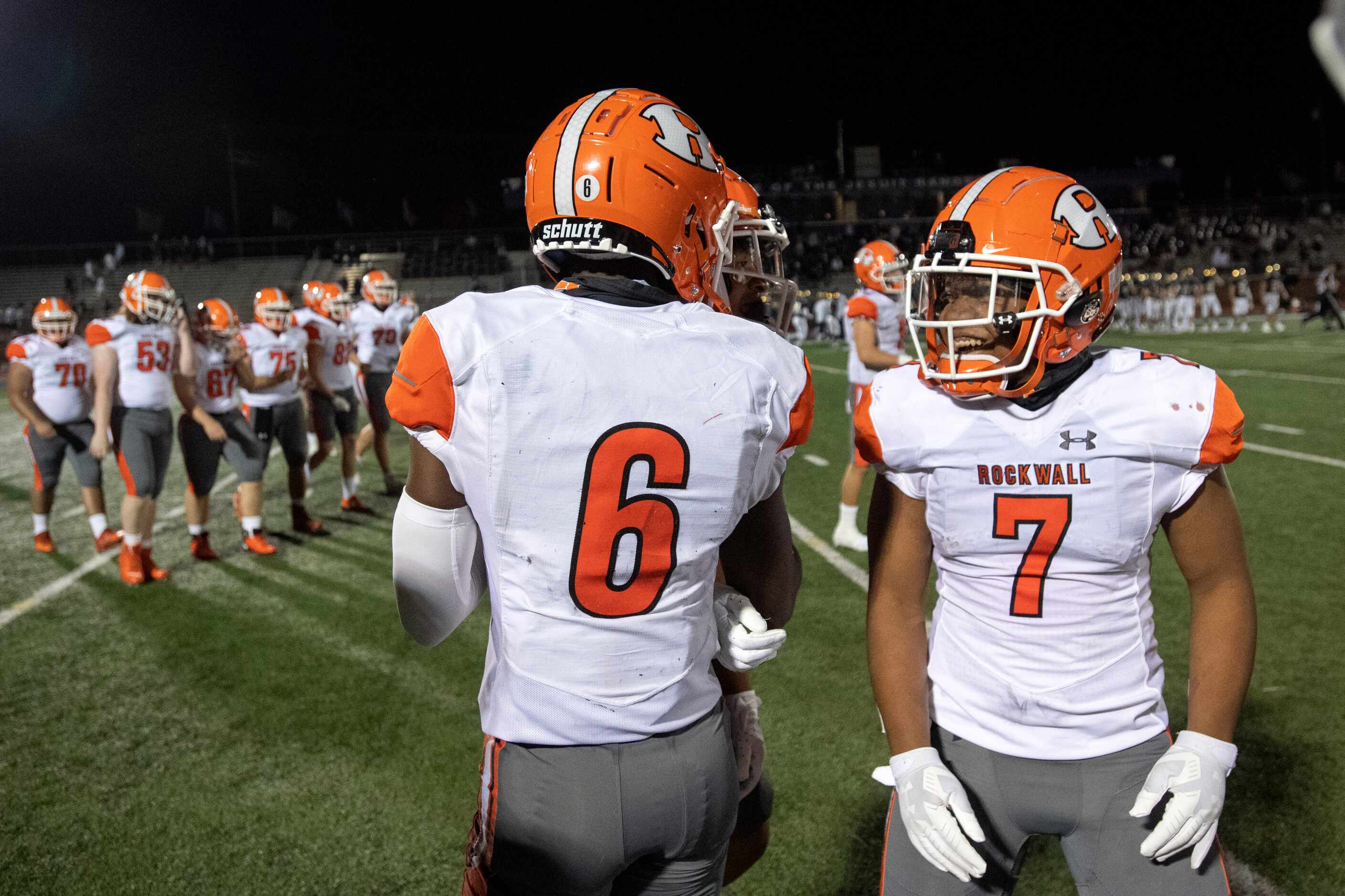 Rockwall senior defensive back Jay Black (6) and senior running back Jackson Bennett (7)...