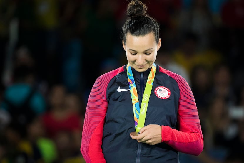 Jackie Galloway of the United States looks at her bronze medal during the medals ceremony...
