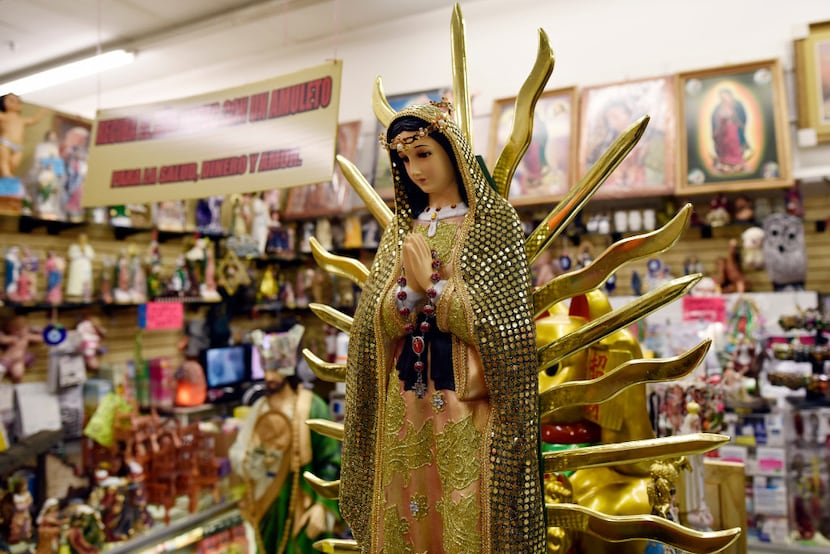 A Virgin of Guadalupe statue is among items for sale at Kathy's Botanica store inside the...