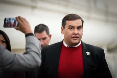 Rep. George Santos, R-NY, walks to his office after a House debate on a resolution to expel...