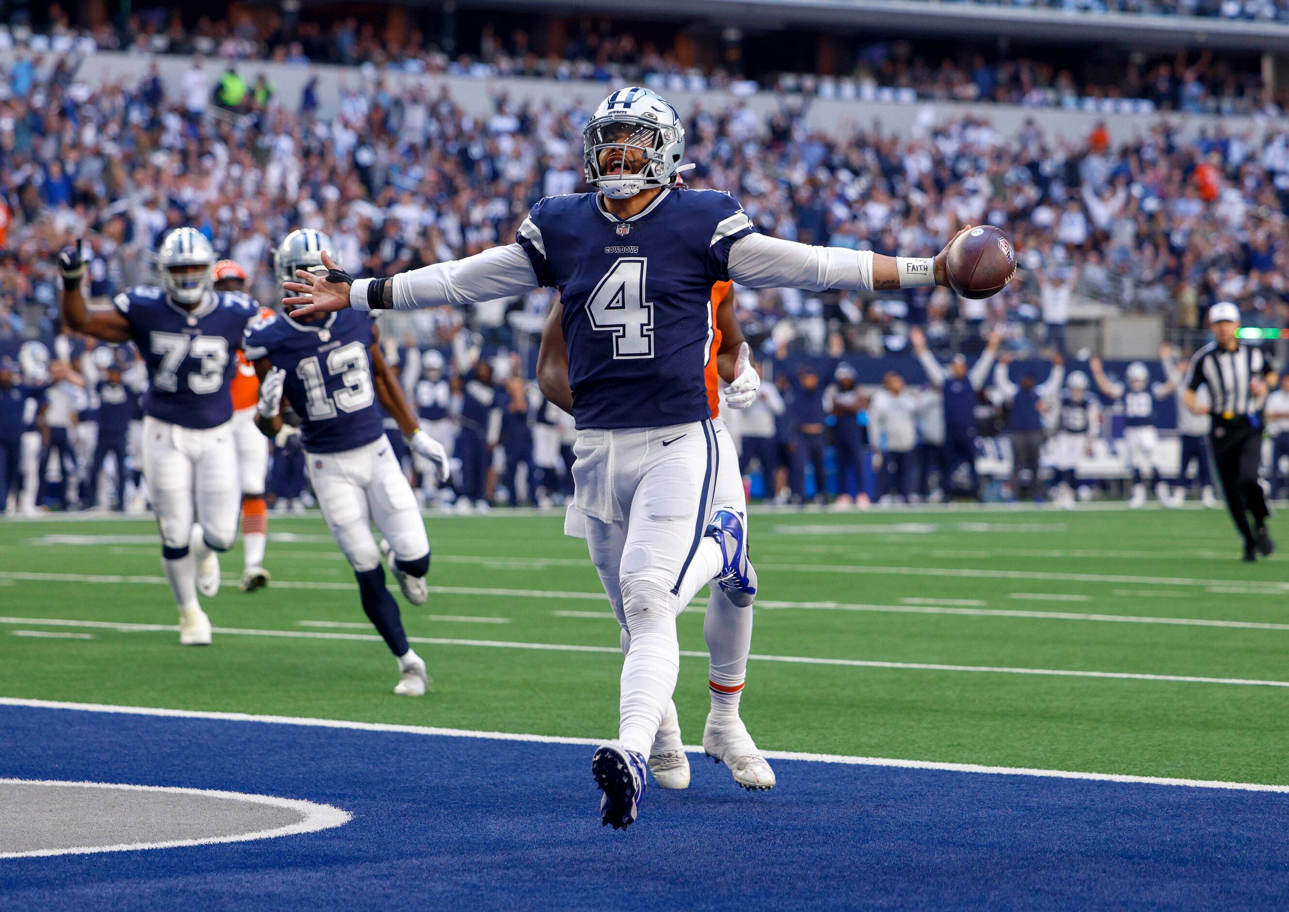 Dallas Cowboys quarterback Dak Prescott (4) celebrates after a seven yard touchdown run...