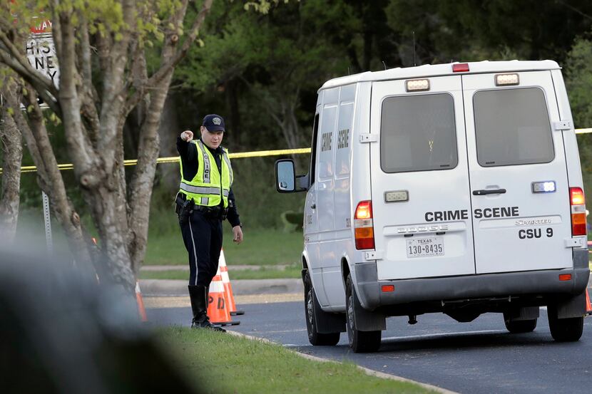 A police crime scene van arrives near the site of Sunday's deadly explosion.