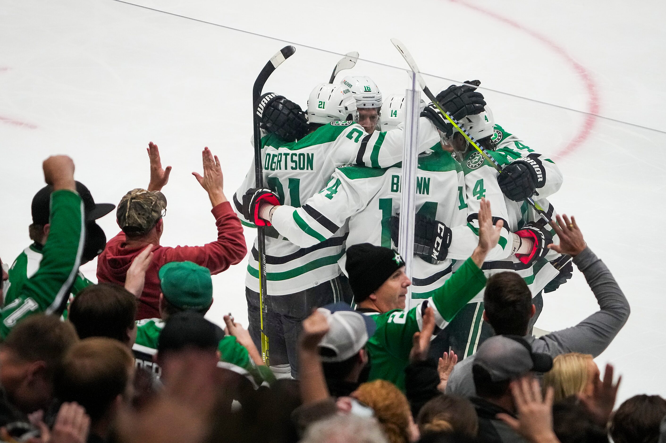 Dallas Stars left wing Jamie Benn (14) celebrates a goal with left wing Jason Robertson...