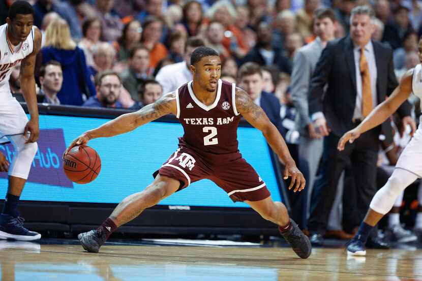 Texas A&M guard TJ Starks dibbles the ball during the first half of an NCAA college...