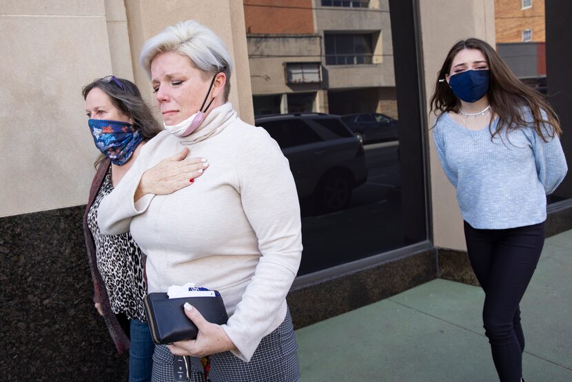 Nicole Reffitt (second from left) and family walk out of the federal courthouse at the...