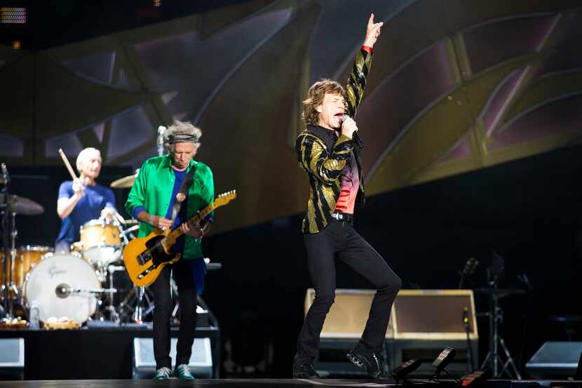 Mick Jagger of the Rolling Stones performs with drummer Charlie Watts and guitarist Keith...