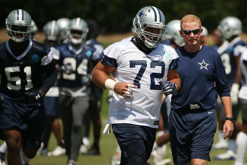 Cowboys center Travis Frederick and head coach Jason Garrett are pictured during mandatory...