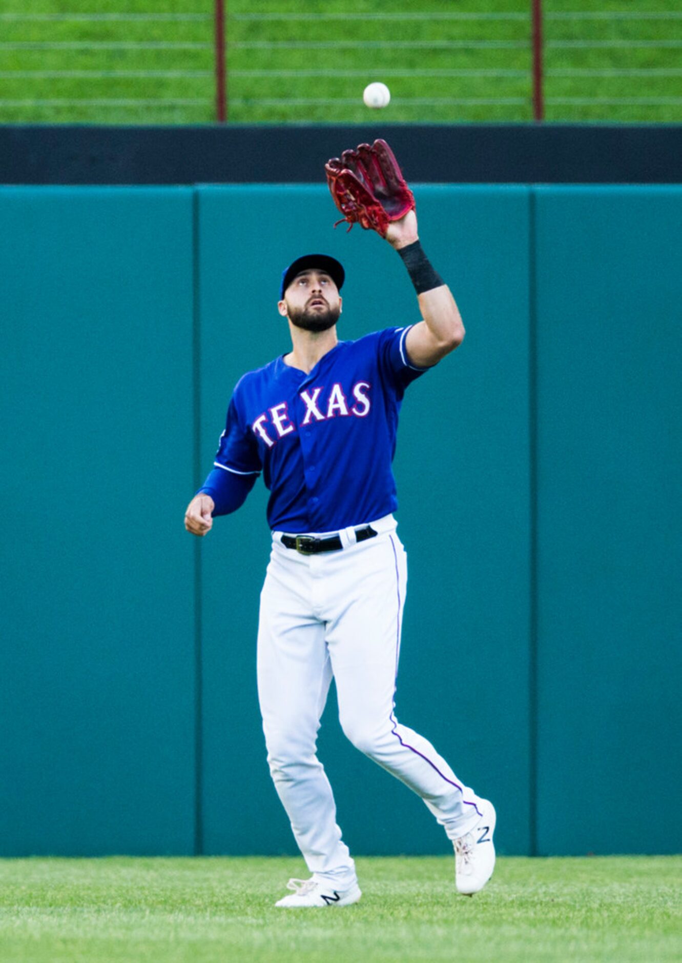 Texas Rangers center fielder Joey Gallo (13) catches a fly ball to the outfield hit by...