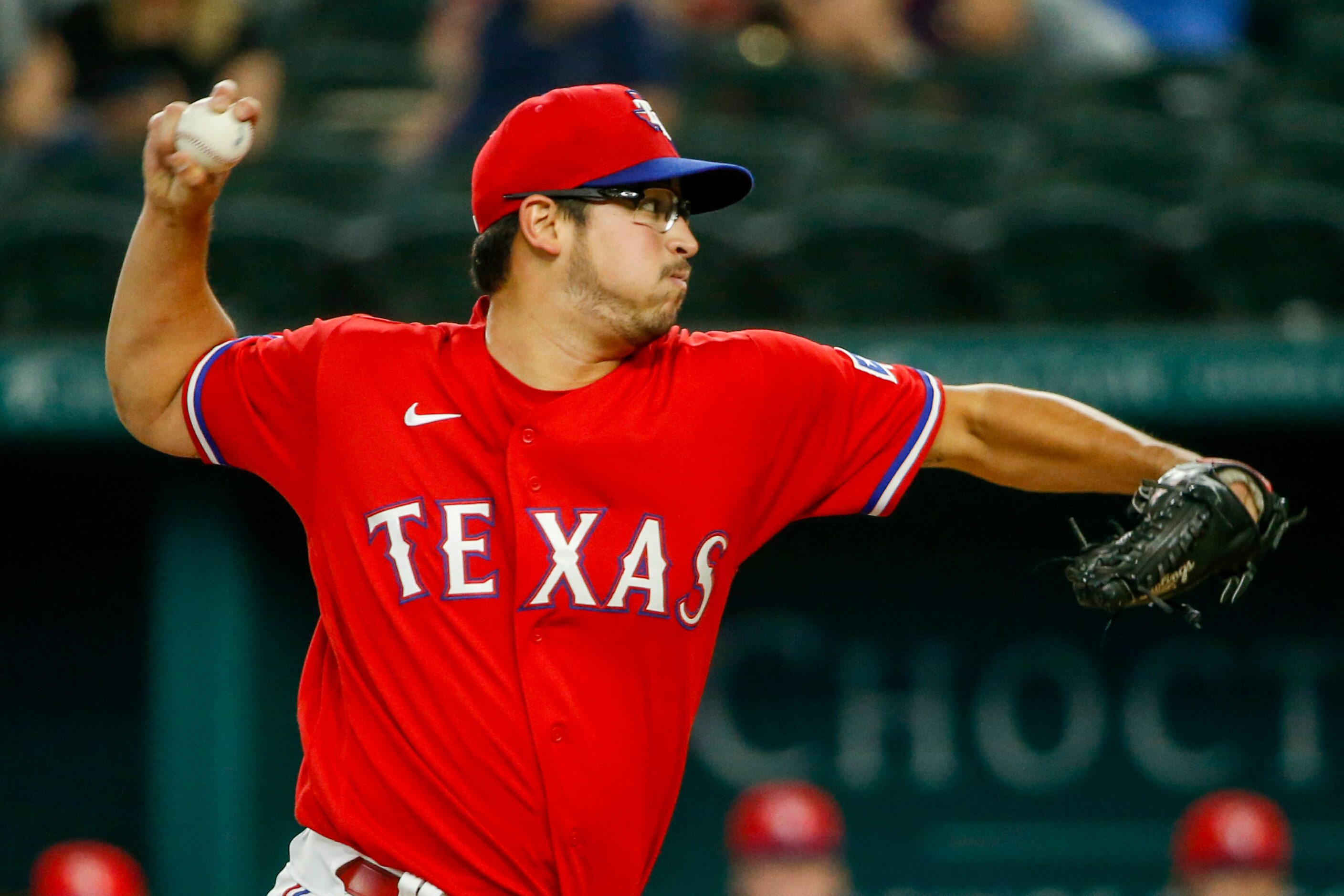 Texas Rangers starting pitcher Dane Dunning (33) delivers a pitch during the first inning...