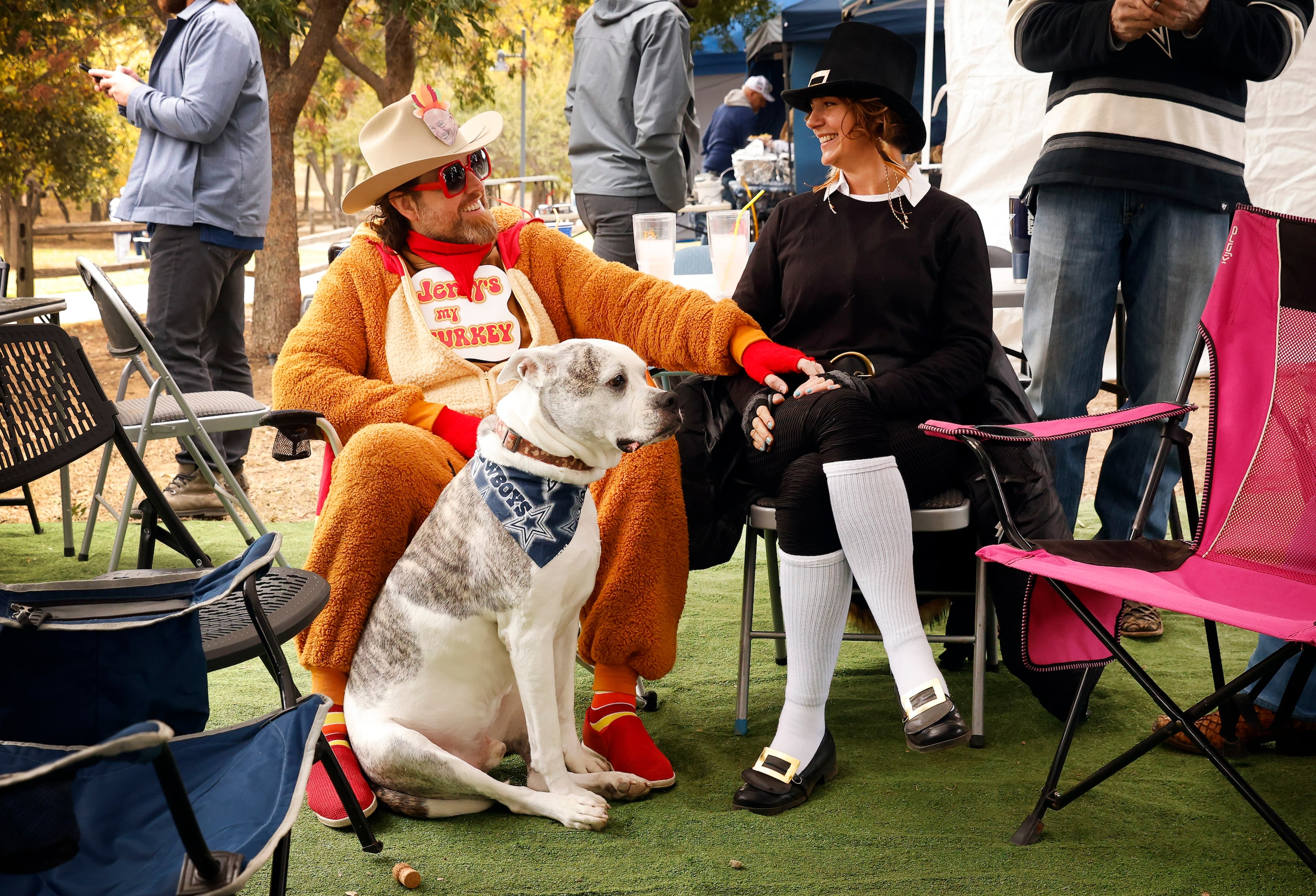 Ryan Ables (left), his wife Amber Ables and their dog Zeppelin dressed the part for the...