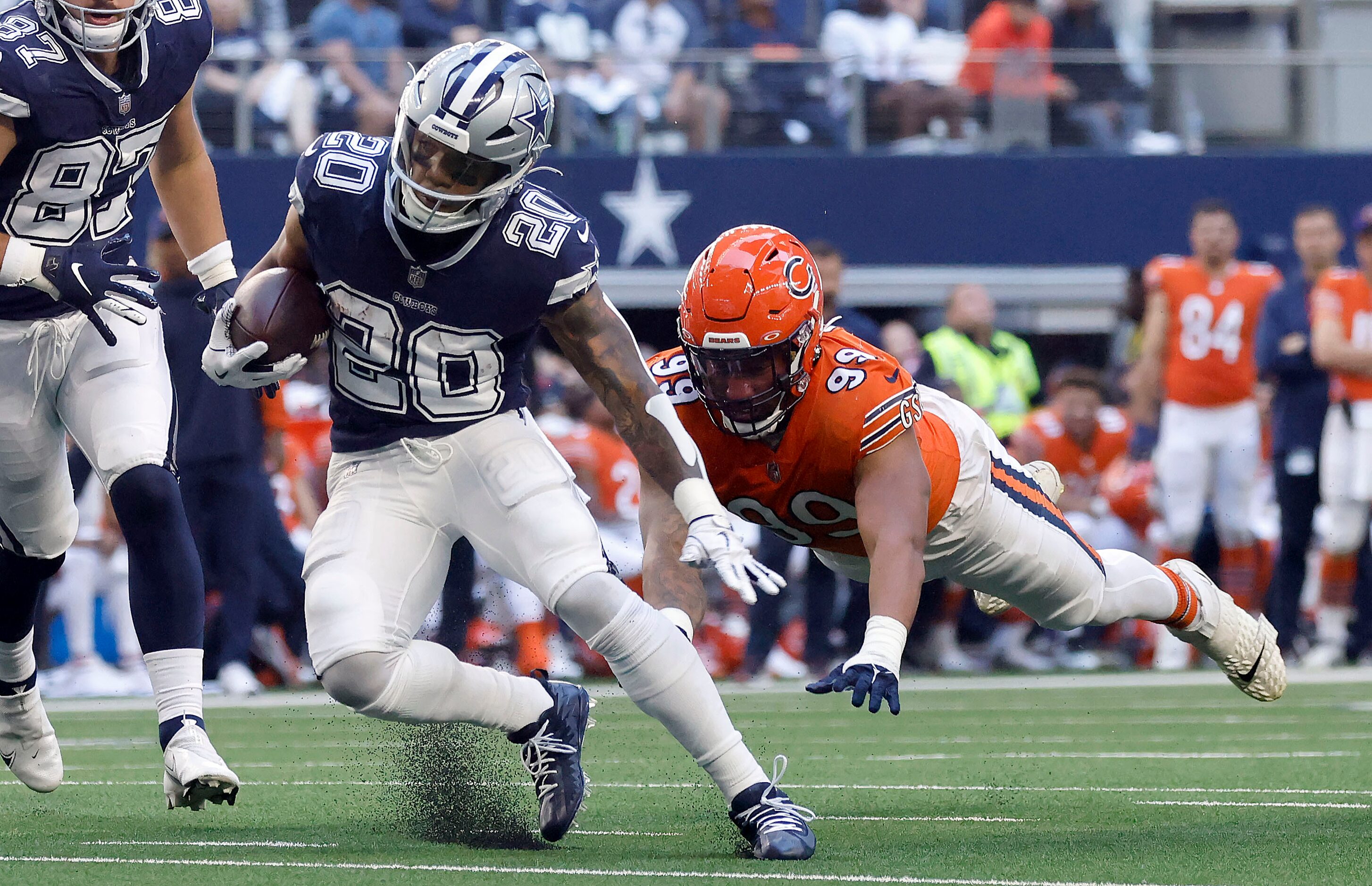 Dallas Cowboys running back Tony Pollard (20) makes a move before racing in for a second...