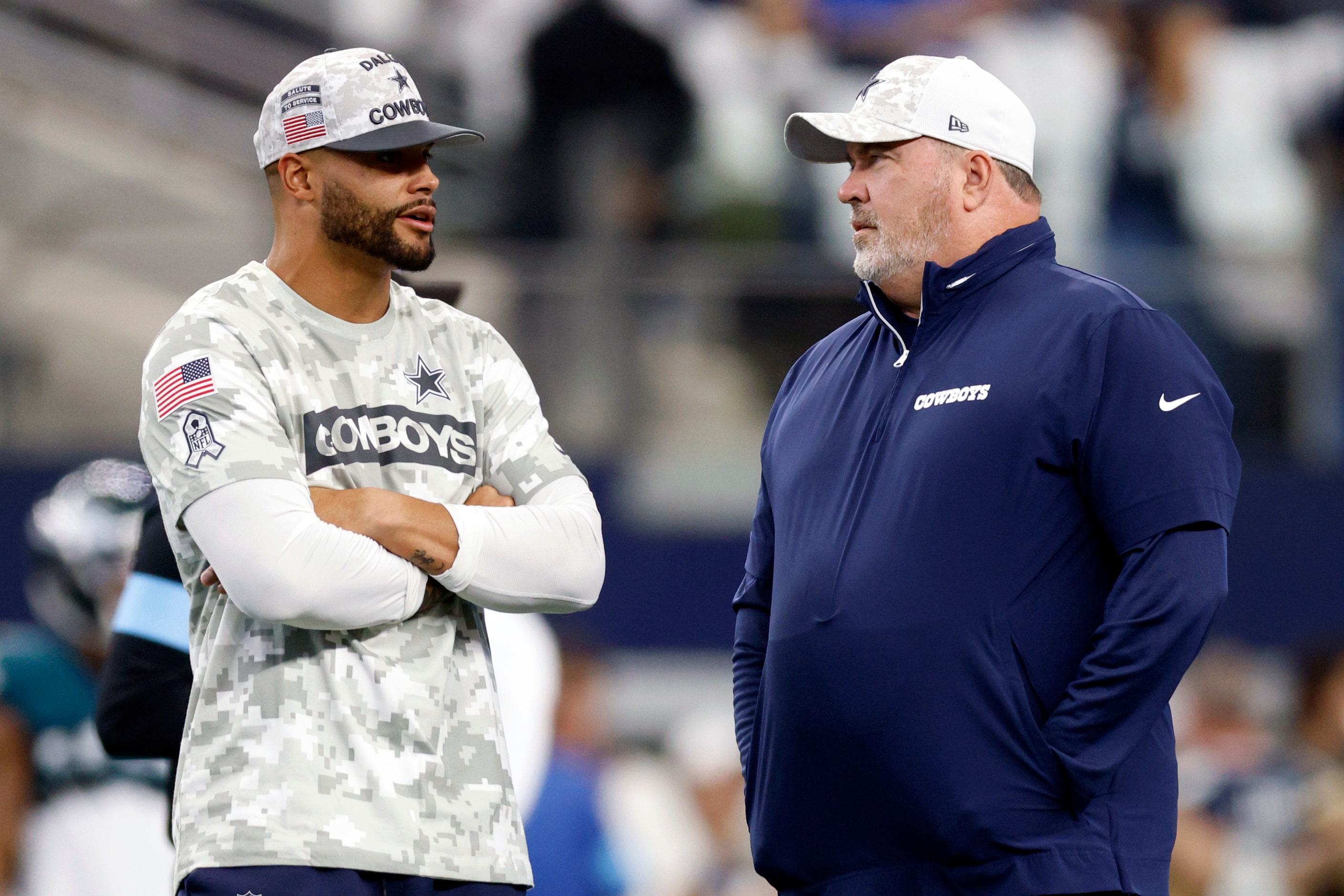 Dallas Cowboys quarterback Dak Prescott talks with head coach Mike McCarthy before an NFL...