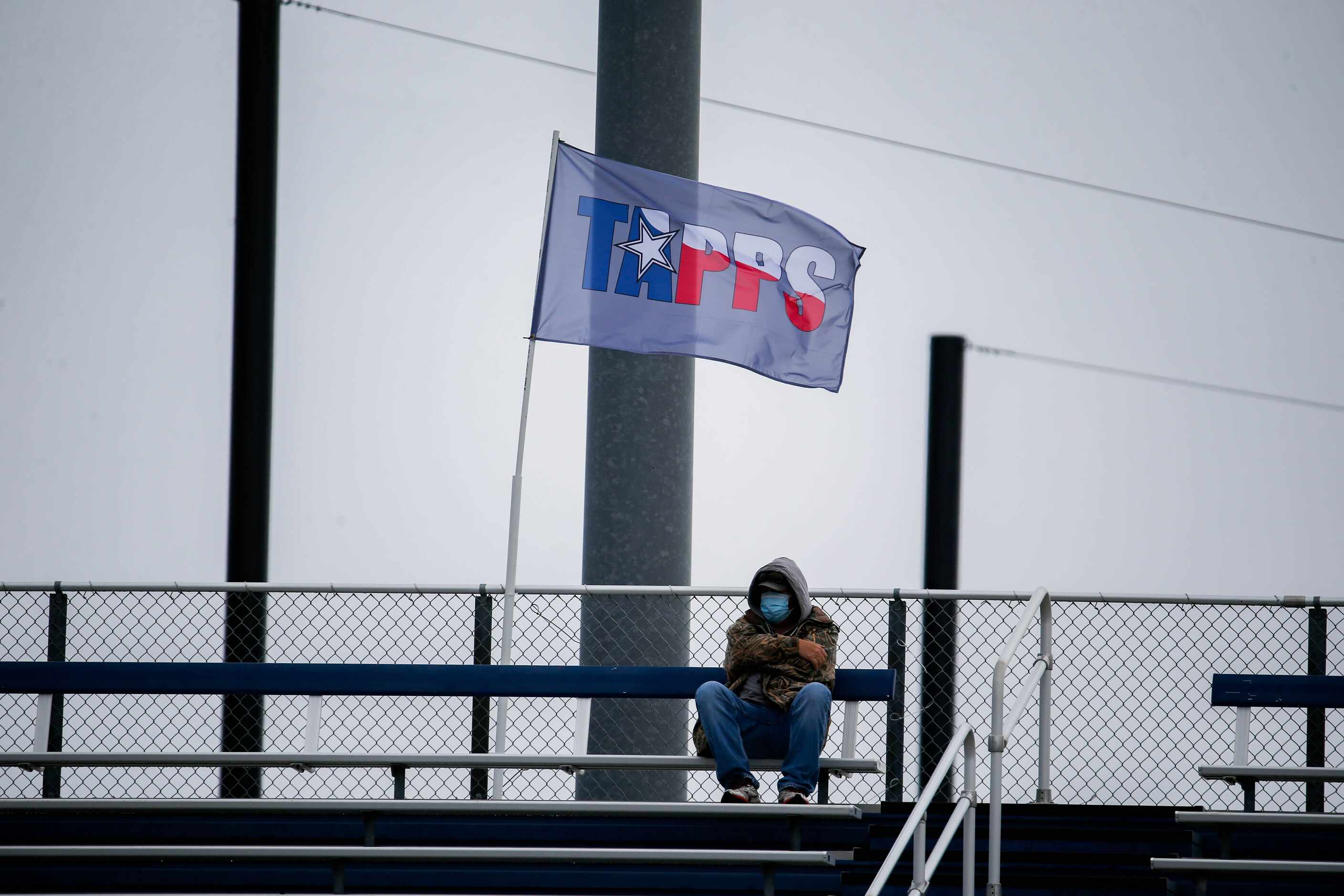 A lone Dallas Christian fan watches during the first half of a TAPPS Division II state...