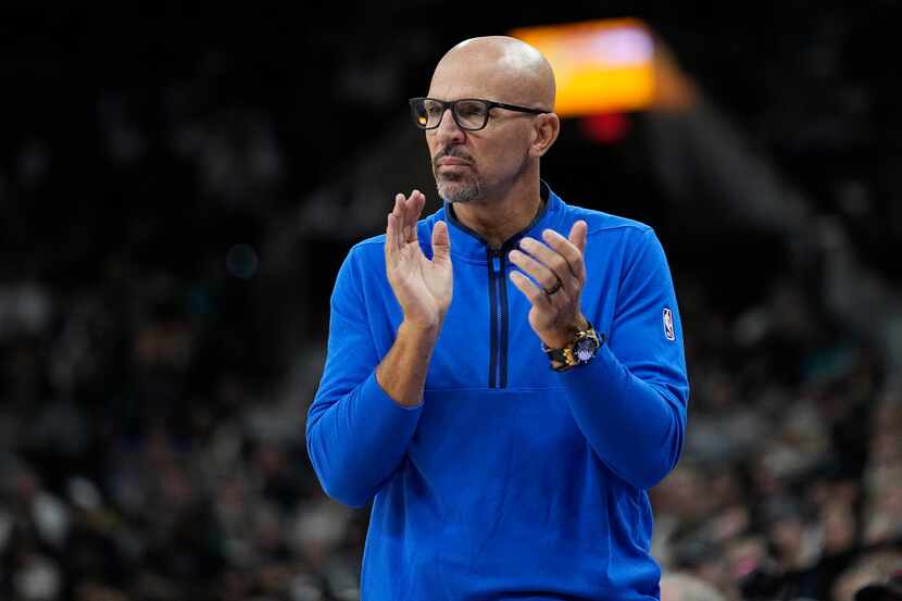 Dallas Mavericks coach Jason Kidd applauds a play during the second half of the team's NBA...