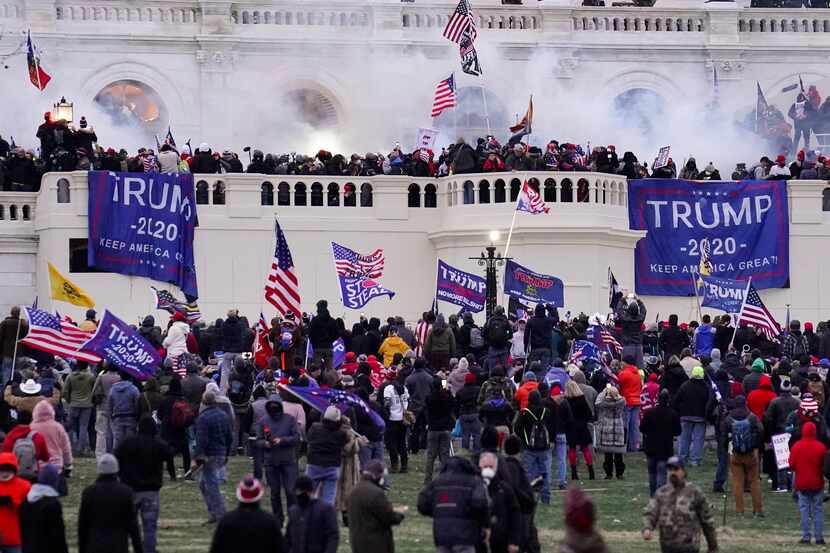 Rioters supporting former President Donald Trump storm the Capitol in Washington on Jan. 6,...
