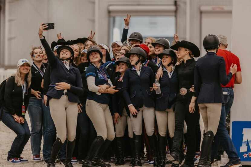 The SMU women's equestrian team celebrates winning the National Collegiate Equestrian...