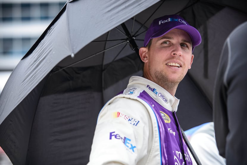 Apr 5, 2014; Fort Worth, TX, USA; Sprint Cup Series driver Denny Hamlin (11) looks on during...