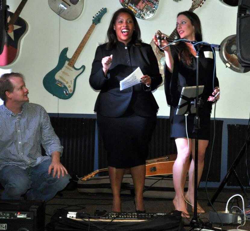 Civil district court judge candidate Bridgett Whitmore (left) speaks on stage alongside...