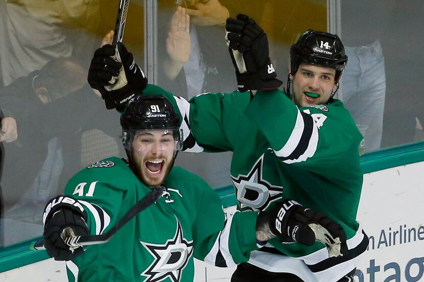 Tyler Seguin #91 of the Dallas Stars and Jamie Benn #14 of the Dallas Stars celebrate after...