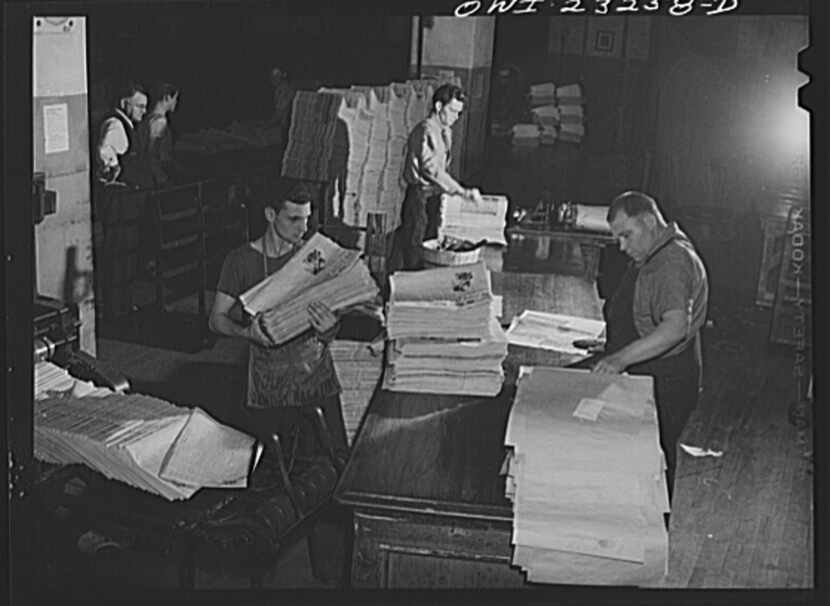 Mail room at The Dallas Morning News in April 1943. In the lower left corner papers are...