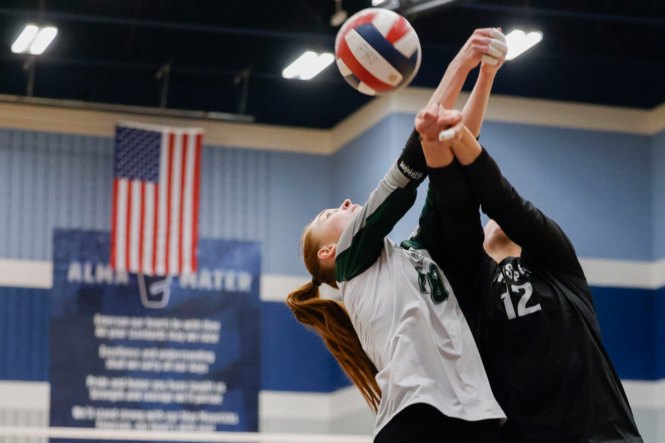 Prosper High’s Sophie Bridges (left) and Allie Duitsman attempt to receive a pass against...