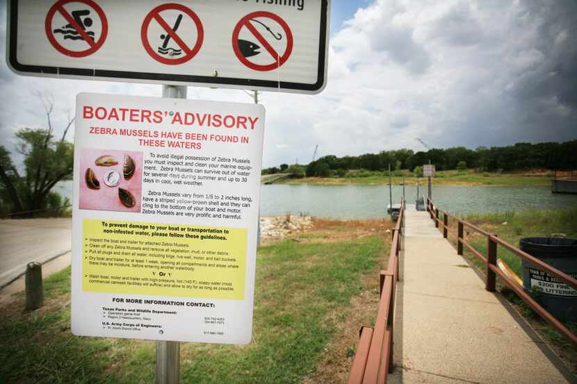 A sign near the boat ramp in Arrowhead Park on Lewisville Lake warns boaters of the dangers...