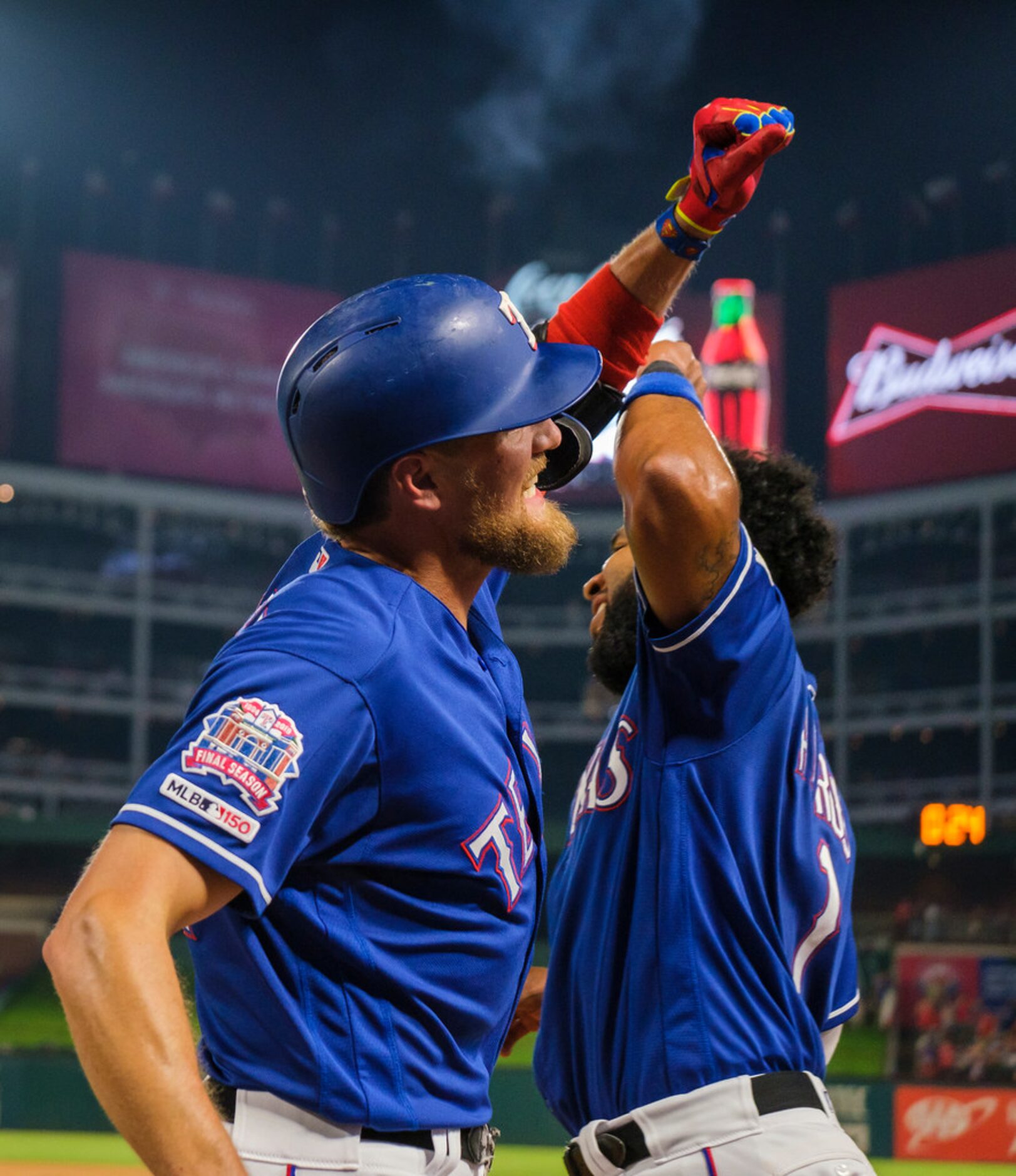 Texas Rangers designated hitter Hunter Pence celebrates with shortstop Elvis Andrus after...