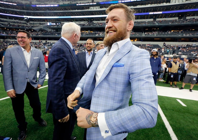 MMA fighter Conor McGregor of Ireland received a tour of the pregame warmups from Dallas...