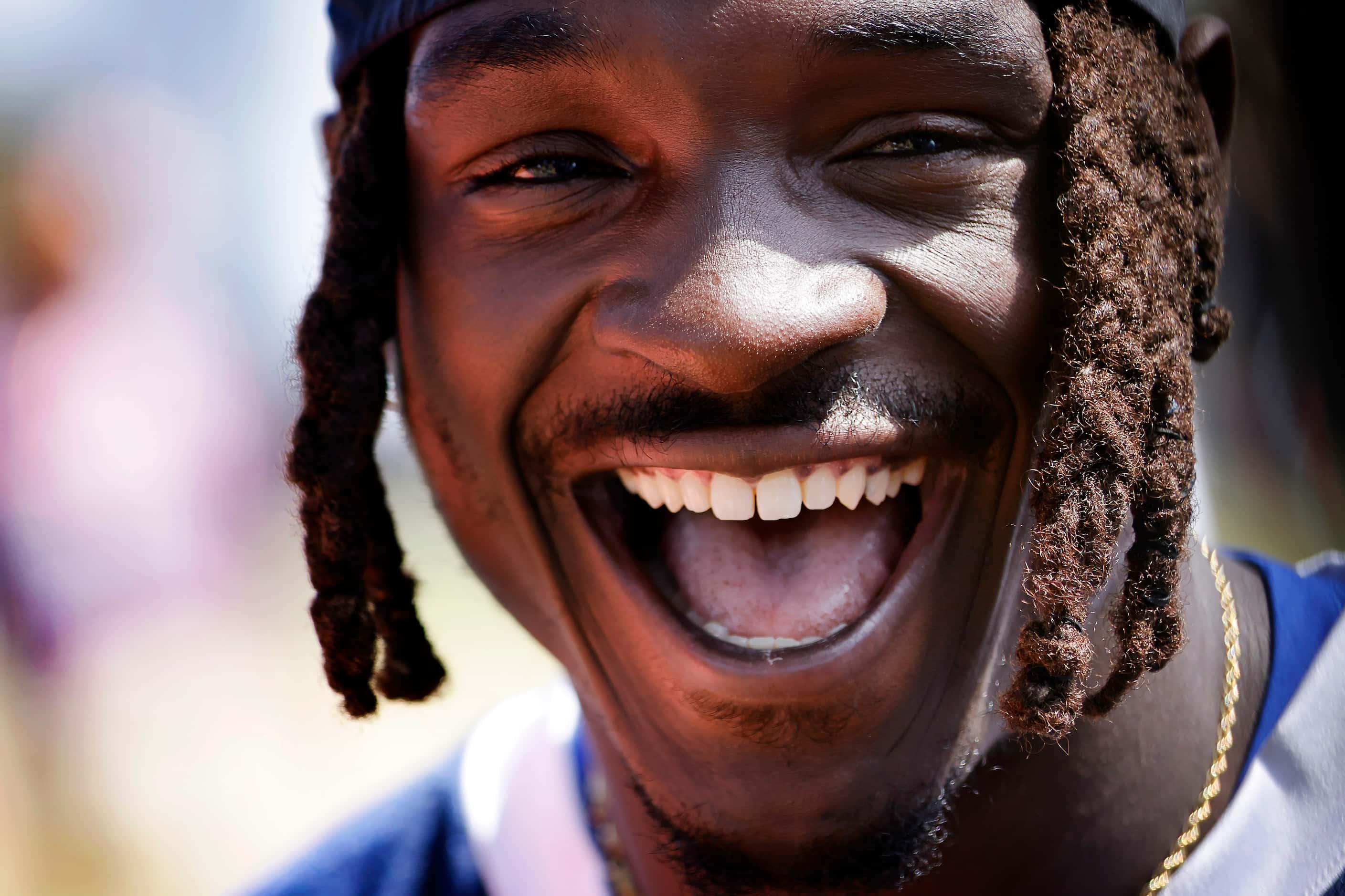 Dallas Cowboys safety Donovan Wilson laughs during post mock game interview at training camp...
