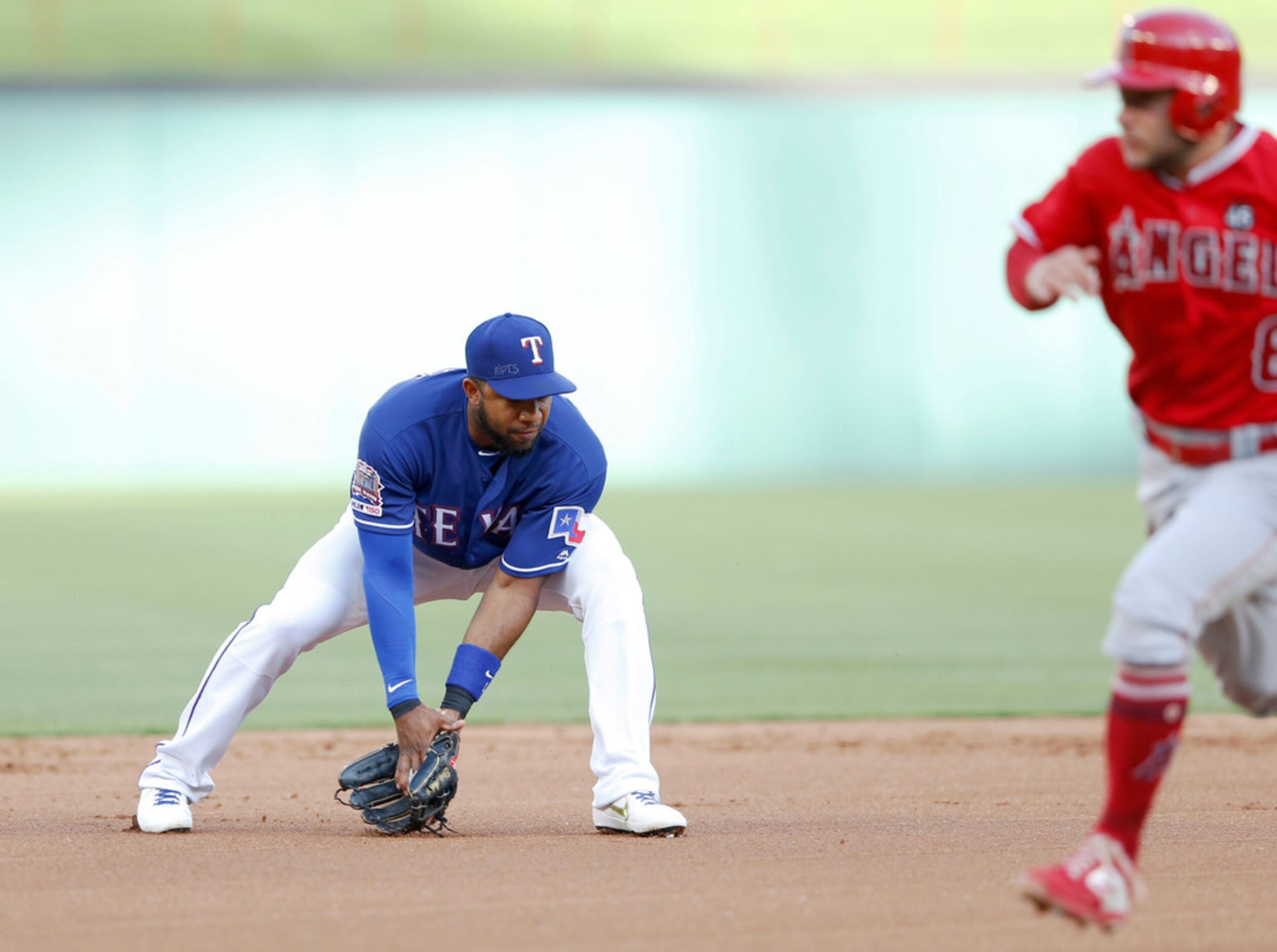 Texas Rangers shortstop Elvis Andrus (1) fields the ball as Los Angeles Angels shortstop...