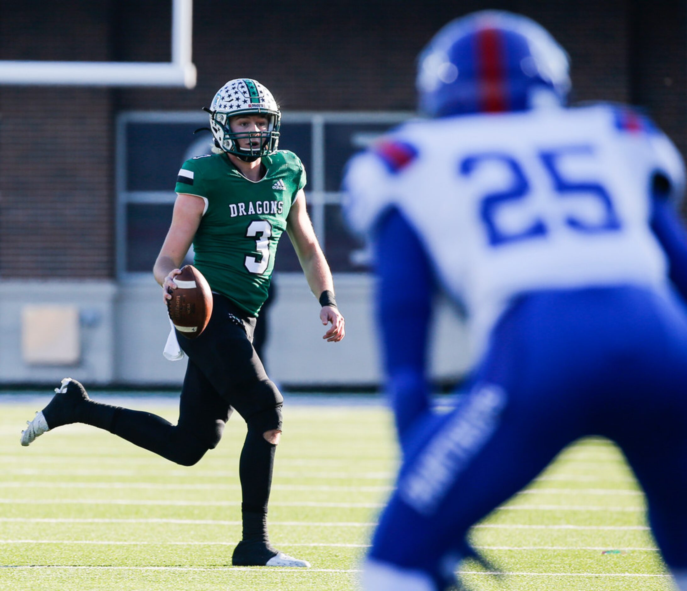 Southlake Carroll quarterback Quinn Ewers (3) looks for a receiver as Duncanville defensive...