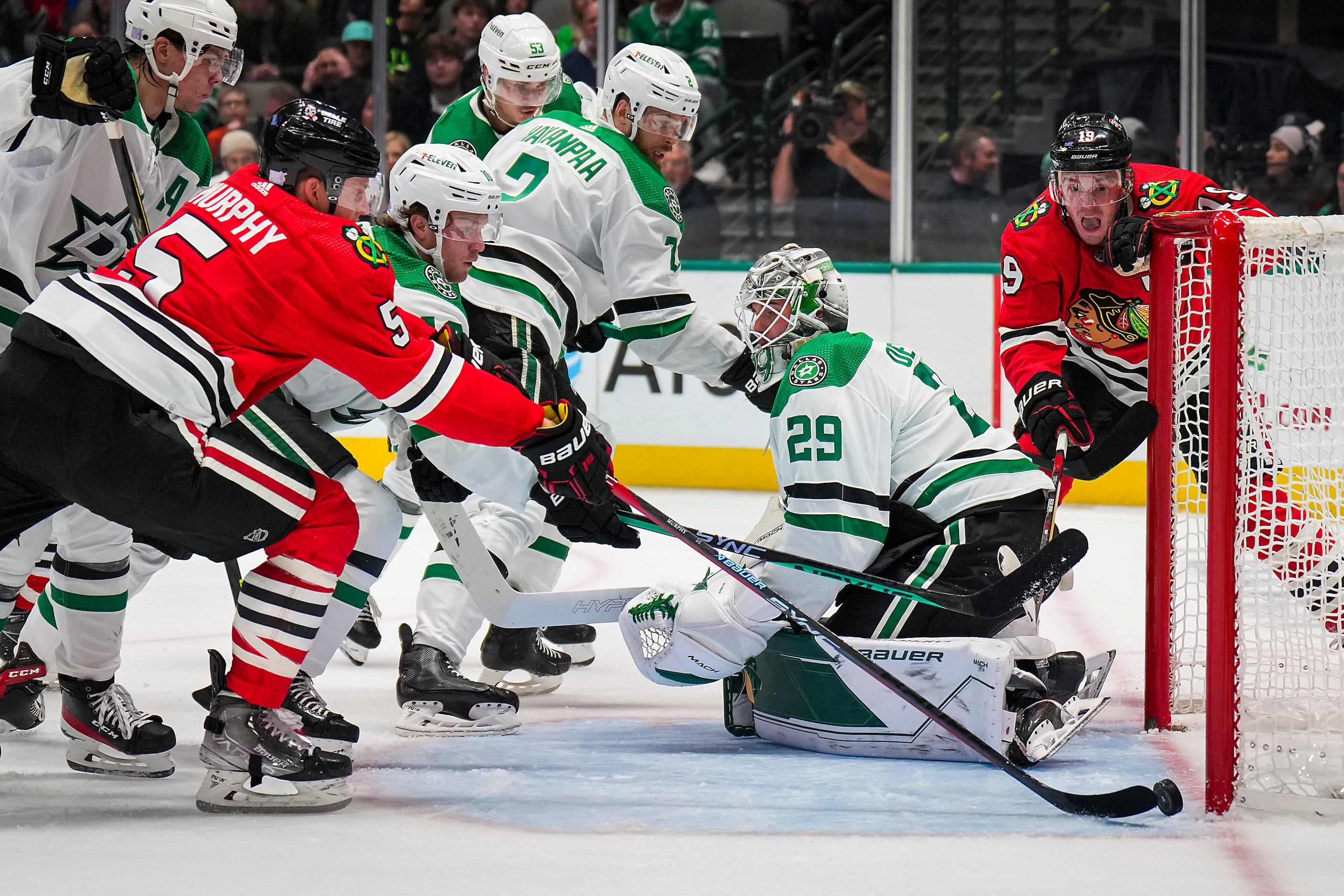 Chicago Blackhawks defenseman Connor Murphy (5) beats Dallas Stars goaltender Jake Oettinger...