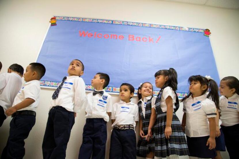 
Pre-K students lined up in the hall on their first day of school at Leonides Gonzalez...