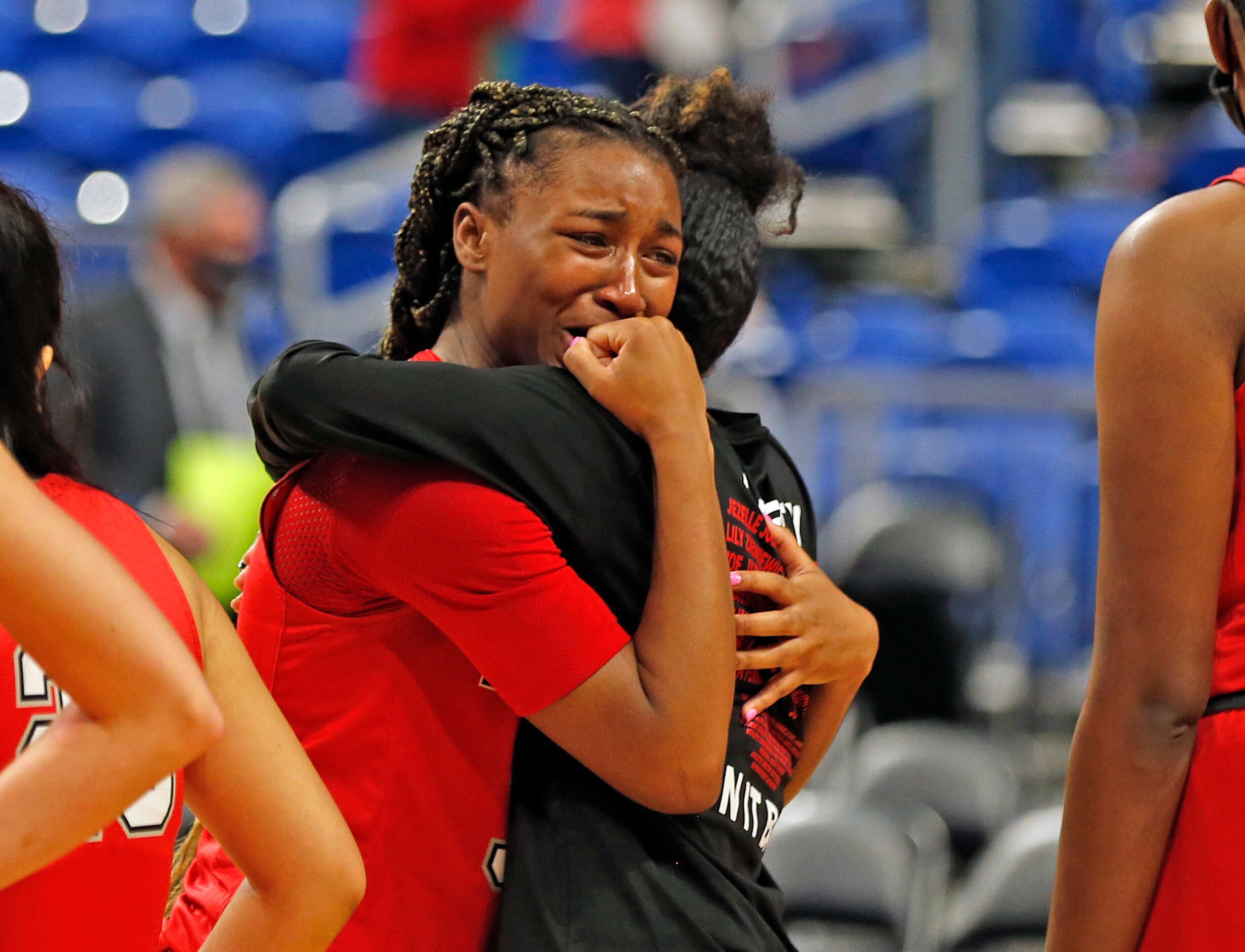 Frisco Liberty Jazzy Owens-Barnett #30 is consoled by Frisco Liberty Zoe Junior #5 after...