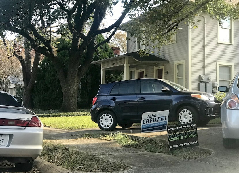 A political yard sign for John Creuzot sits in front of a Dallas home on Wednesday, November...