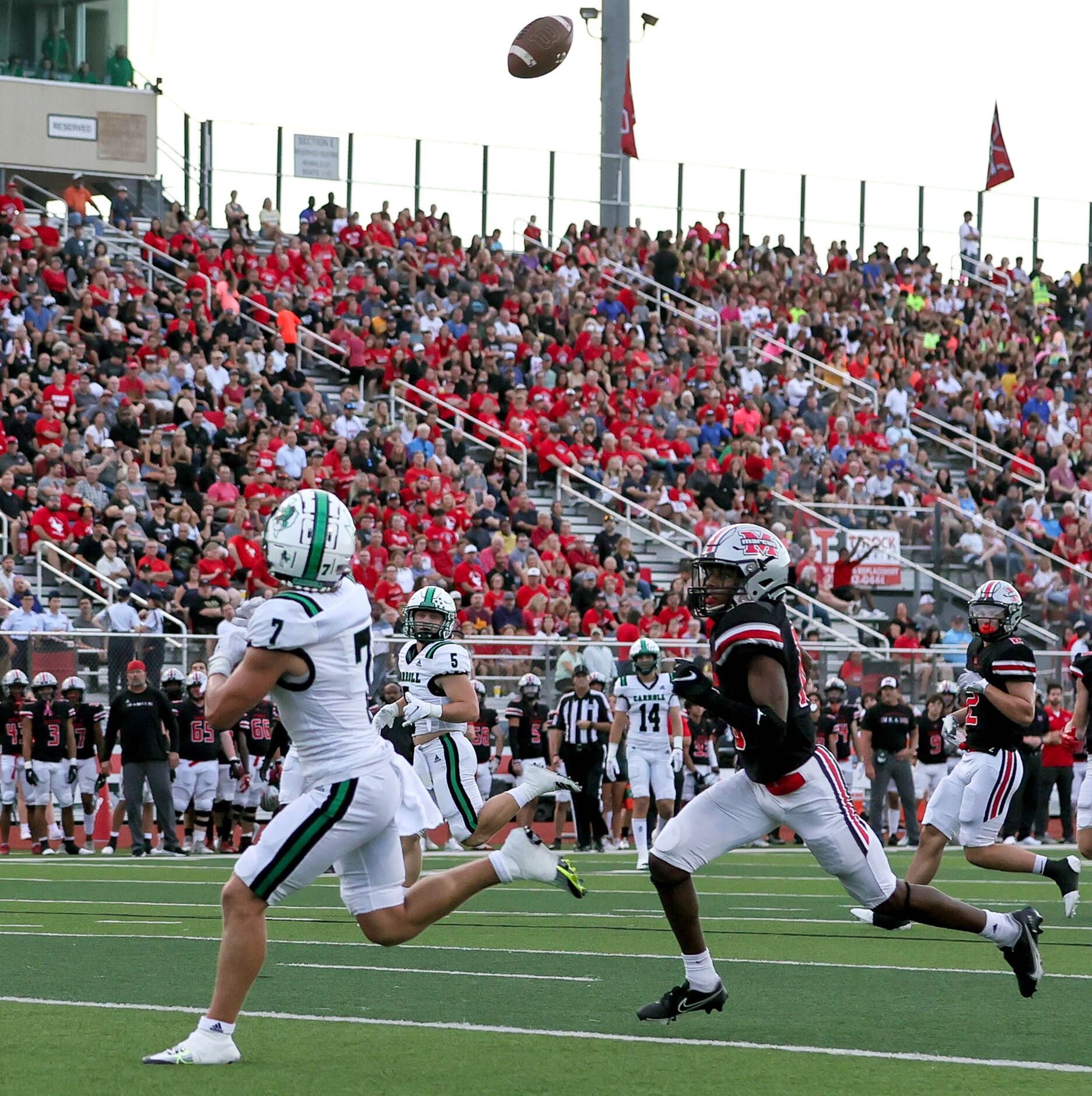 Southlake Carroll wide receiver Jacob Jordan (7) comes up with a touchdown reception against...