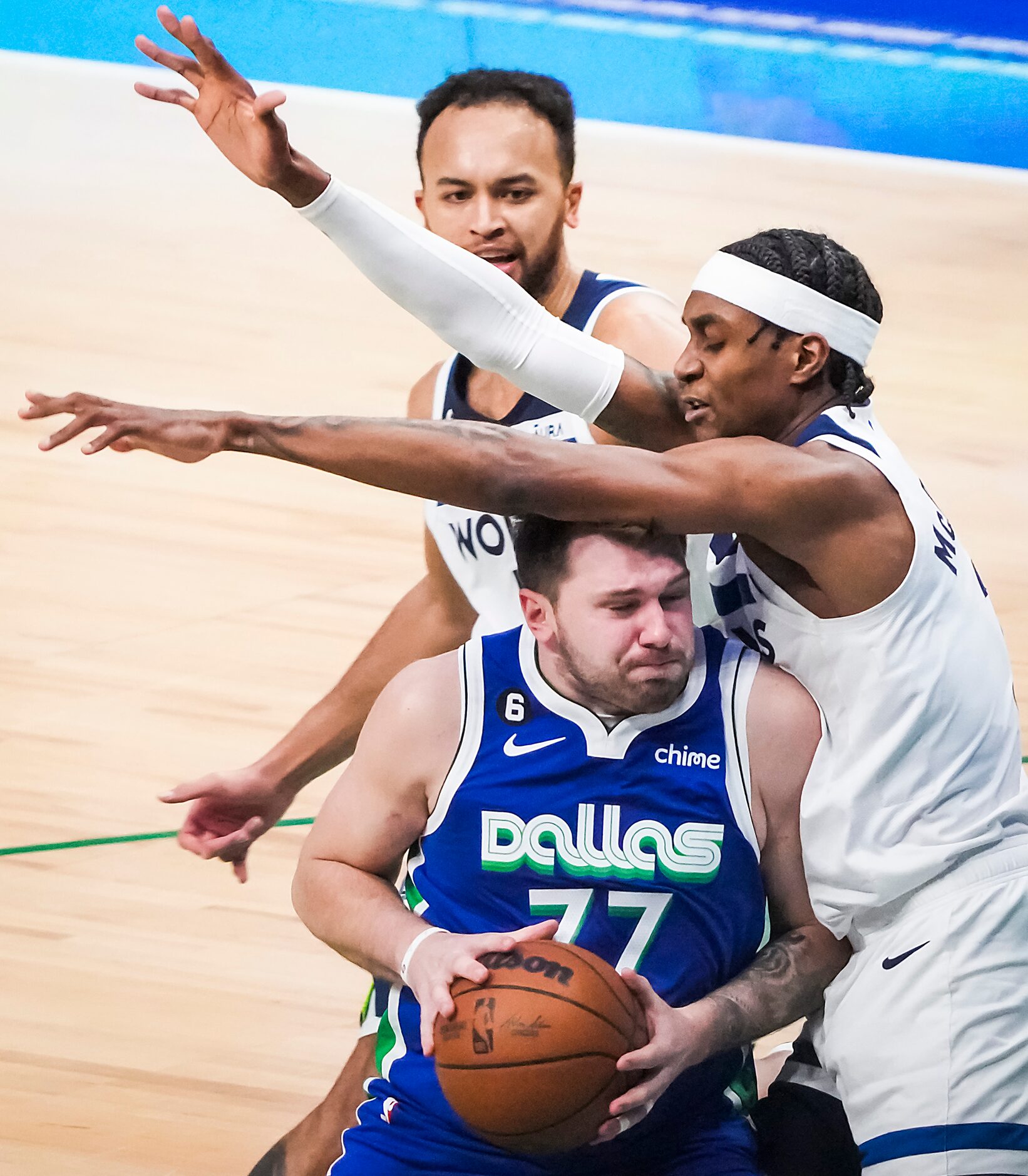 Dallas Mavericks guard Luka Doncic (77) is fouled by Minnesota Timberwolves forward Jaden...