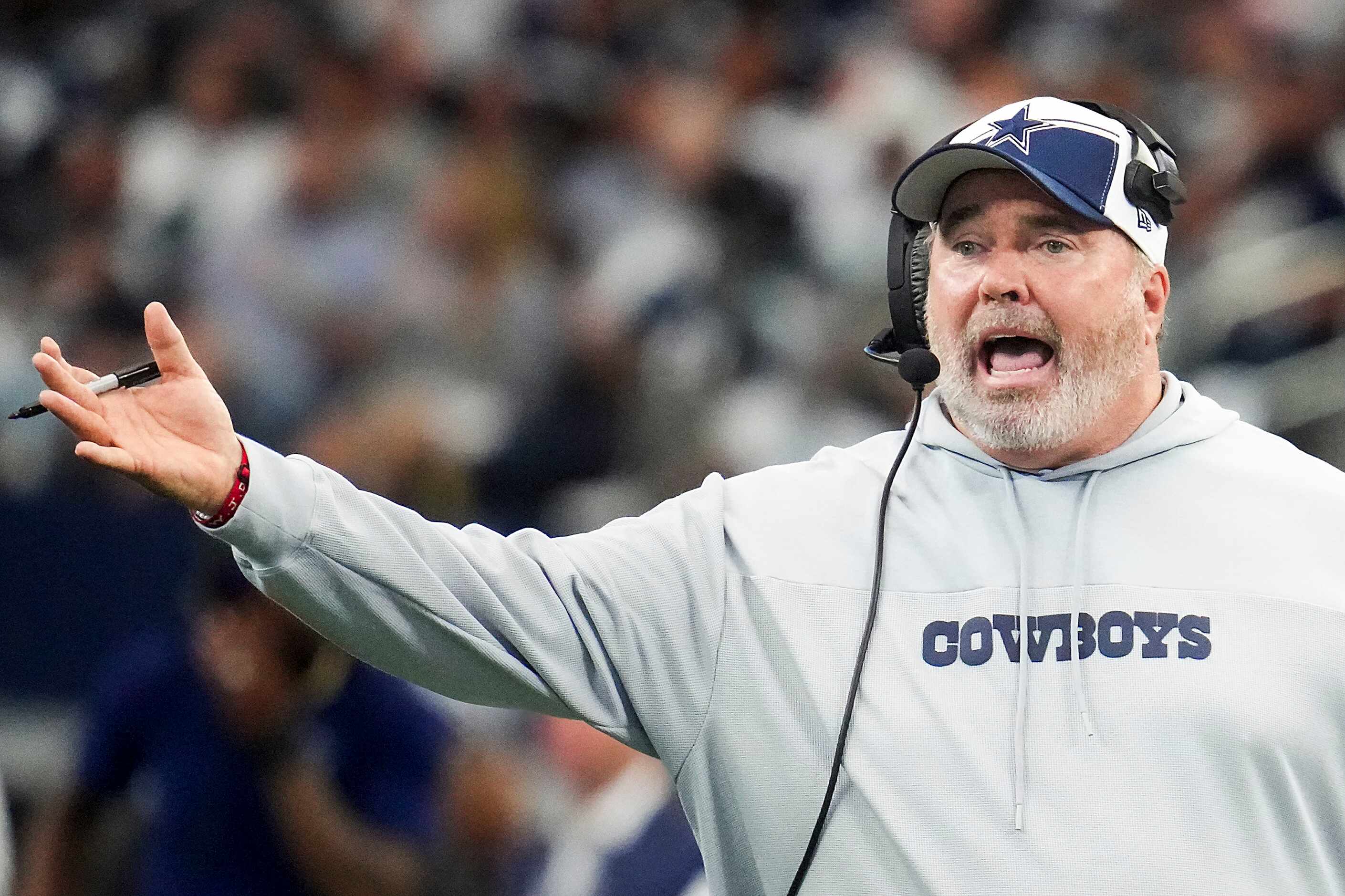 Dallas Cowboys head coach Mike McCarthy questions a call during the first half an NFL...