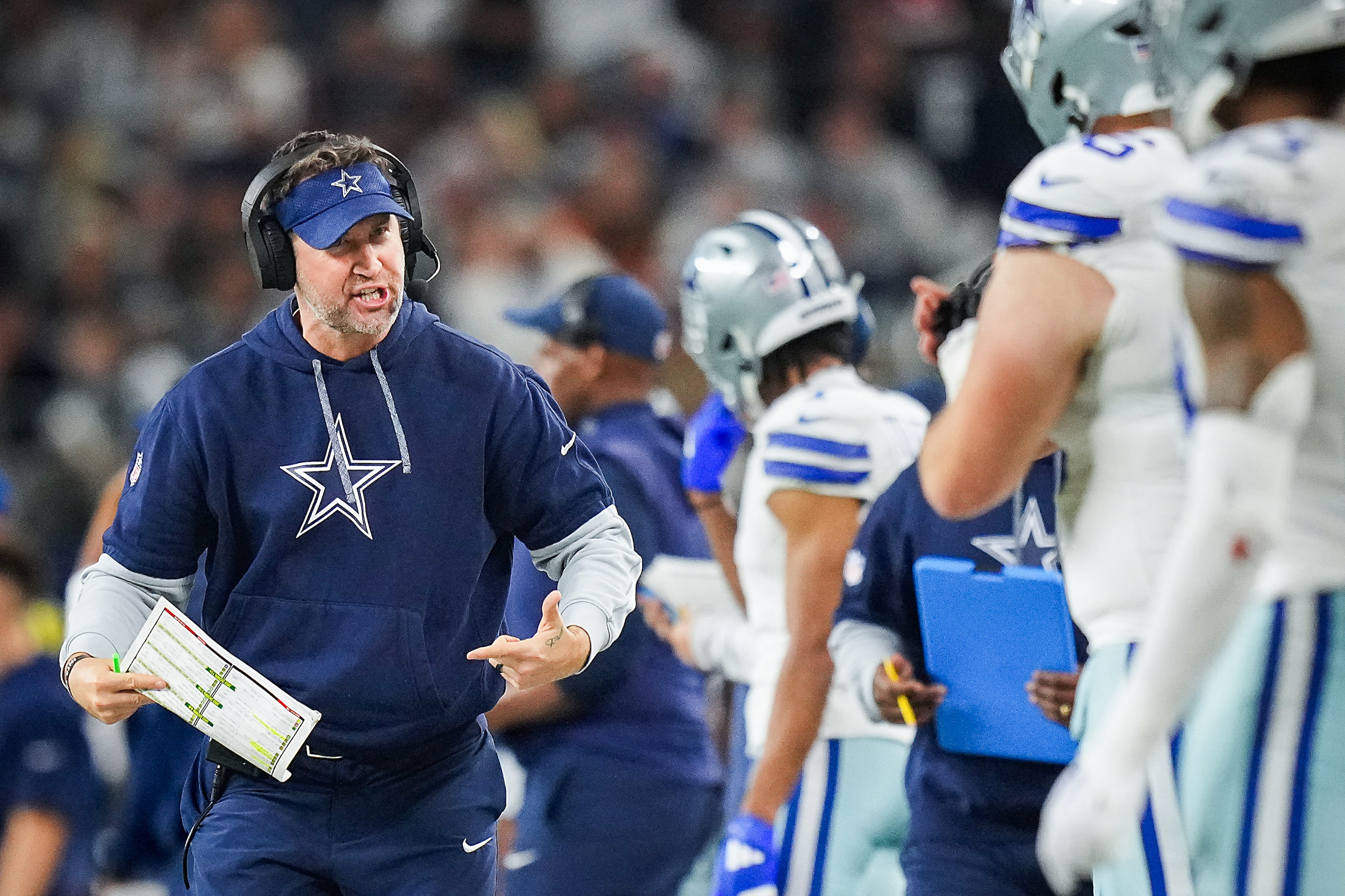 Dallas Cowboys offensive coordinator Brian Shottenheimer works on the sidelines during the...