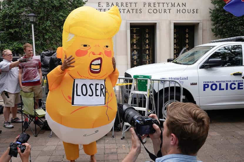 A protester as "Baby Trump" at the E. Barrett Prettyman U.S. Federal Courthouse, Thursday,...
