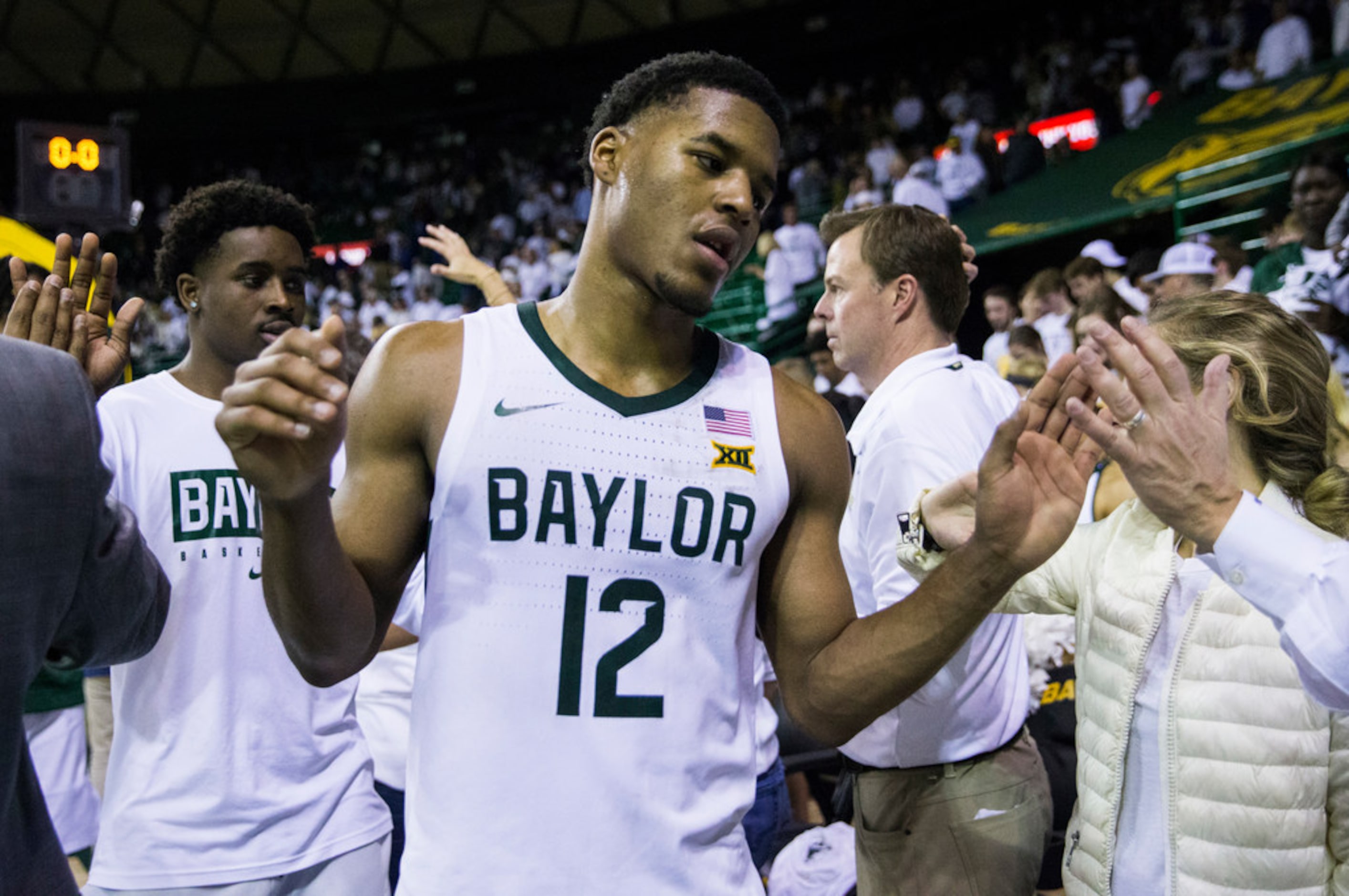 Baylor Bears guard Jared Butler (12) reacts to a 64-61 loss to Kansas Jayhawks after an NCAA...