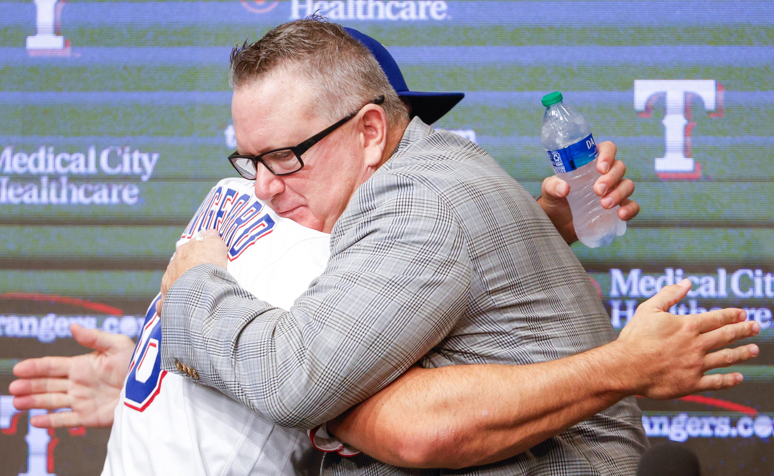 Texas Rangers top pick Wyatt Langford (left) embraces Texas Rangers Senior Director of...