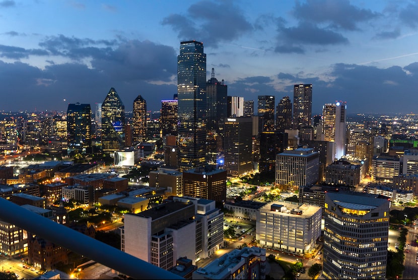 The city skyline lights up as if it was night a totality happens during the total solar...