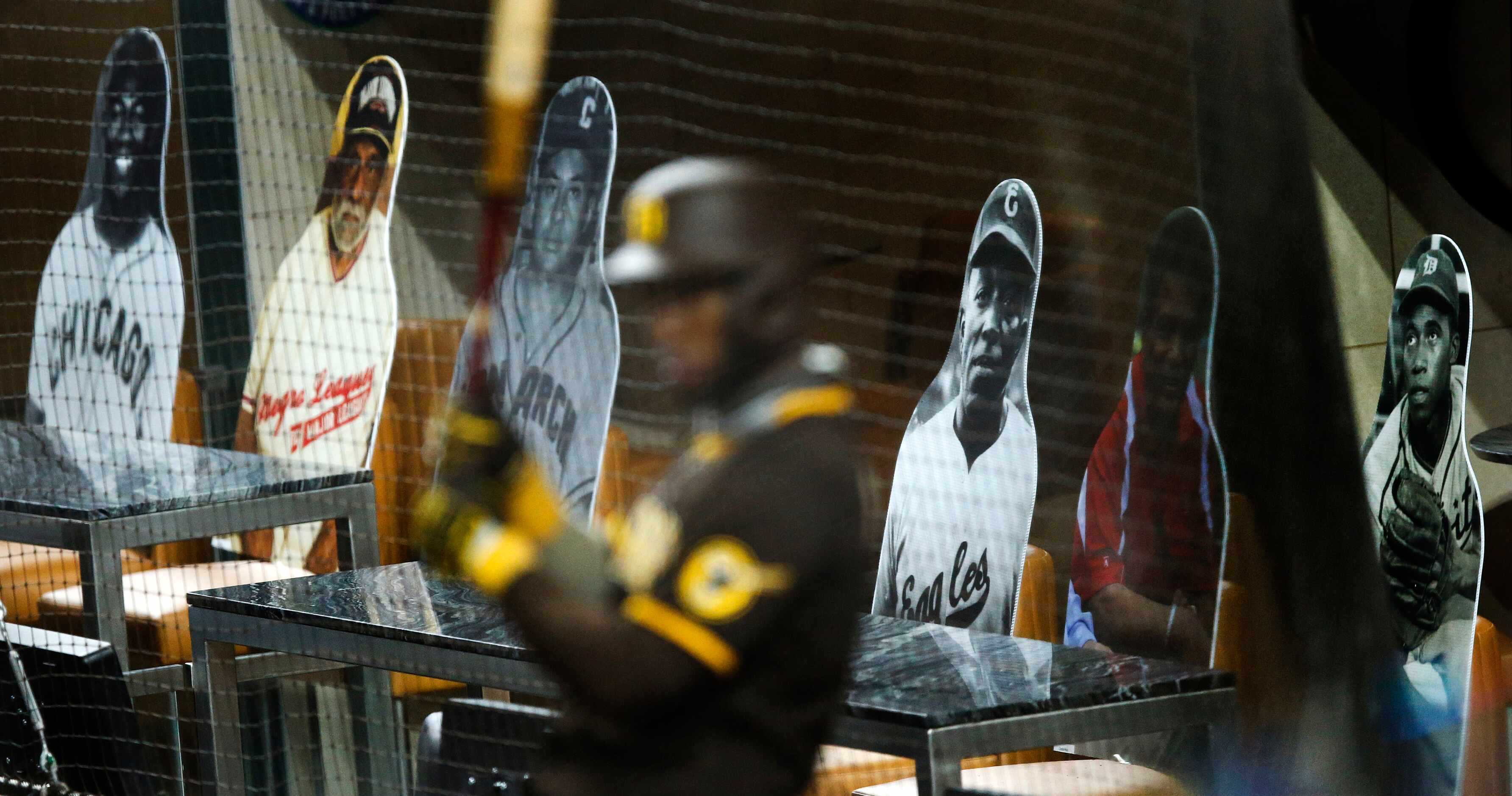 Cutouts of famous Negro League players fill the field level suites behind home plate as San...